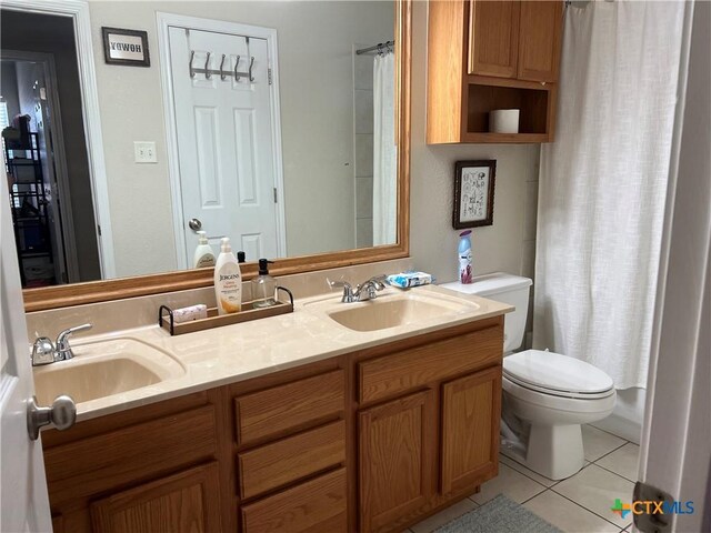 2019 Stonehenge Dr, Harker Heights, TX 76548 - bathroom with tile patterned flooring, double vanity, toilet, and a shower with shower curtain