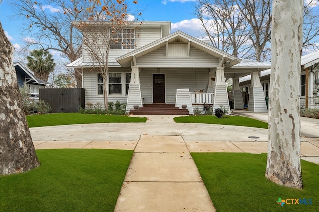 view of front of home featuring a porch and a front lawn