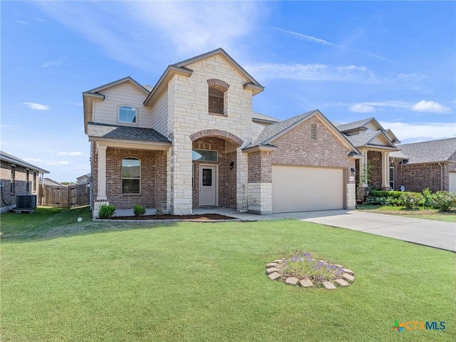 french provincial home with a shingled roof, a front yard, and brick siding