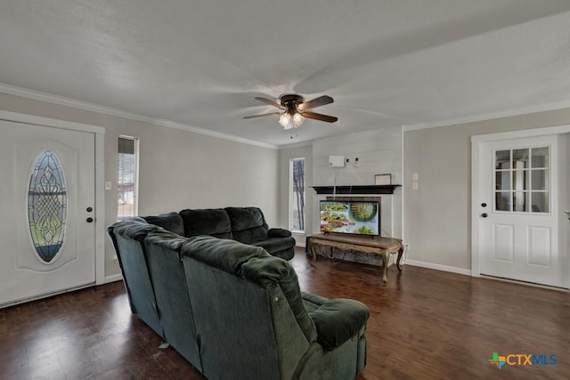 living room with ornamental molding, a wealth of natural light, ceiling fan, and dark hardwood / wood-style flooring