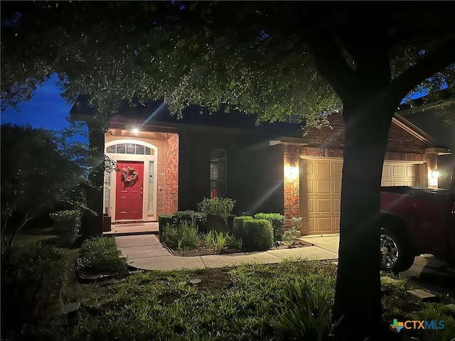 view of front of property with a garage