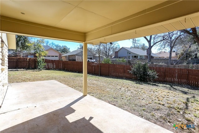 view of patio / terrace with a fenced backyard and a residential view