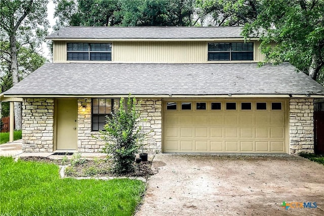 2505 Canyon Creek Dr, Temple, TX 76502 - view of front of home featuring stone siding, driveway, and a garage