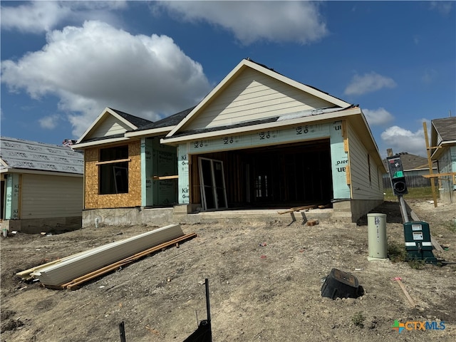 unfinished property featuring a garage