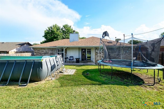 209 Brookway Dr, Killeen, TX 76542 - back of property featuring a trampoline and a chimney