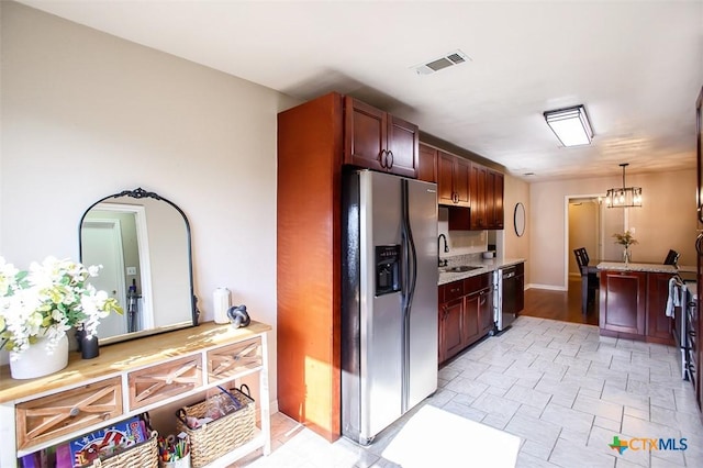 209 Brookway Dr, Killeen, TX 76542 - kitchen featuring stainless steel refrigerator with ice dispenser, dishwasher, light stone countertops, pendant lighting, and stone finish flooring