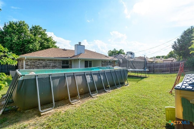 209 Brookway Dr, Killeen, TX 76542 - view of pool with a trampoline and a fenced backyard
