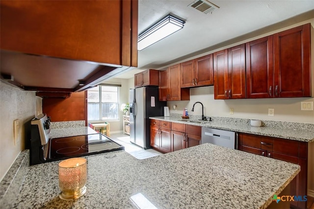 209 Brookway Dr, Killeen, TX 76542 - kitchen featuring stainless steel appliances, dark brown cabinets, ventilation hood, and light stone counters
