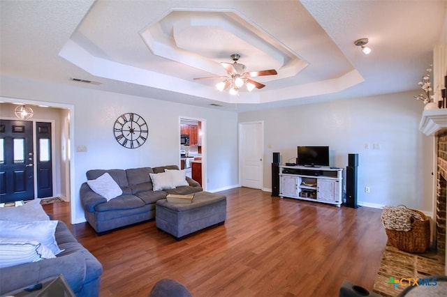 209 Brookway Dr, Killeen, TX 76542 - living area with a tray ceiling, ceiling fan, and wood finished floors