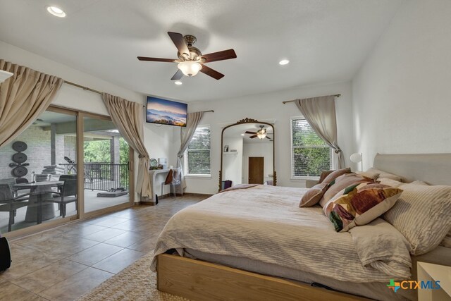 bedroom featuring access to outside, tile patterned floors, and ceiling fan