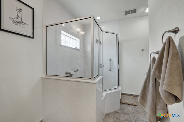 bathroom with a tile shower