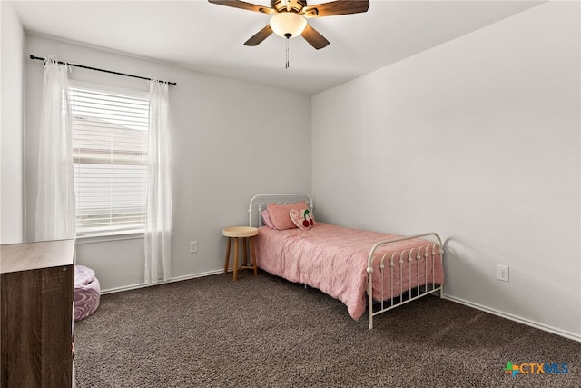 bedroom with carpet floors, multiple windows, and a ceiling fan