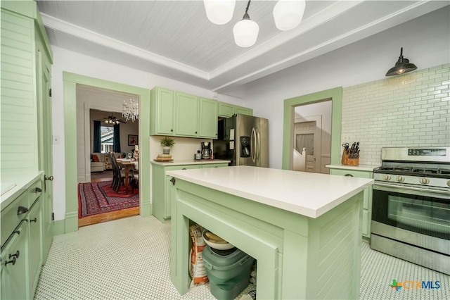 kitchen featuring stainless steel appliances, green cabinets, an inviting chandelier, and light countertops