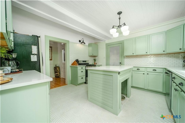 kitchen with green cabinetry, tasteful backsplash, appliances with stainless steel finishes, and light countertops