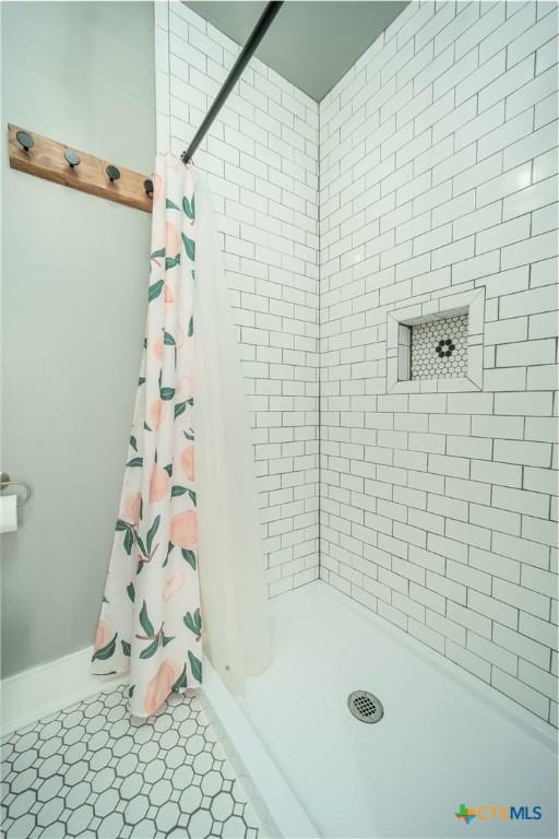 bathroom with a stall shower