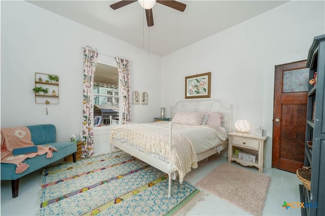 bedroom featuring wood finished floors and ceiling fan