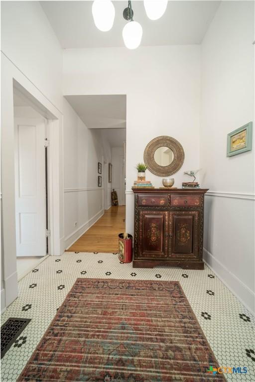 corridor with tile patterned flooring