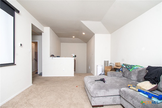 living room featuring light colored carpet and lofted ceiling