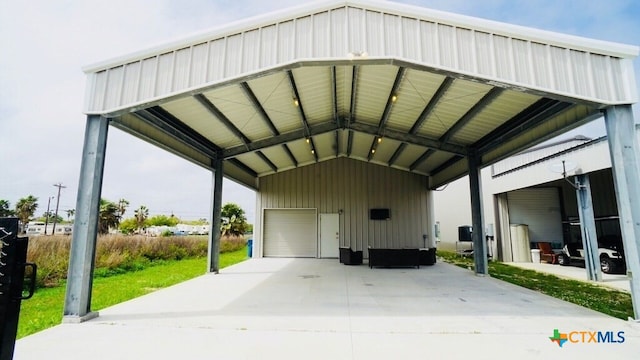 view of parking / parking lot with a carport and a garage