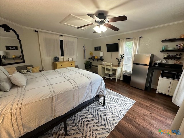 610 N 7th St, Temple, TX 76501 - bedroom featuring freestanding refrigerator, dark wood-type flooring, crown molding, attic access, and ceiling fan
