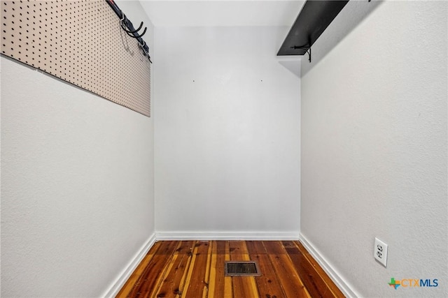 610 N 7th St, Temple, TX 76501 - spacious closet with dark wood-style flooring