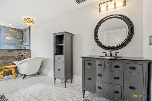 610 N 7th St, Temple, TX 76501 - bathroom featuring vanity, a freestanding tub, and tiled shower