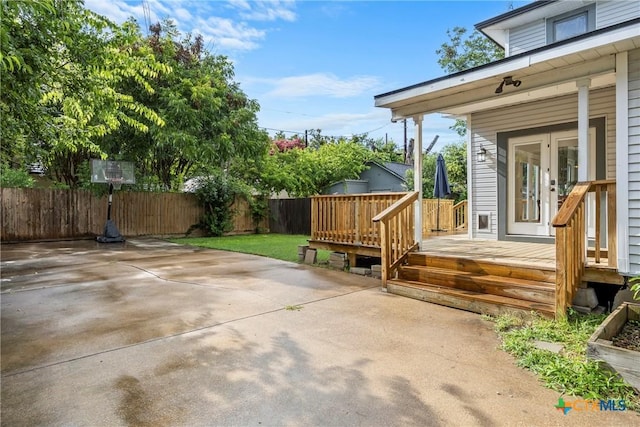 610 N 7th St, Temple, TX 76501 - view of patio featuring a deck and french doors