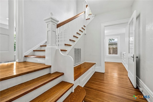 610 N 7th St, Temple, TX 76501 - stairs featuring wood finished floors and plenty of natural light