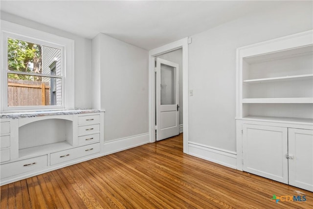 610 N 7th St, Temple, TX 76501 - unfurnished bedroom featuring light wood finished floors