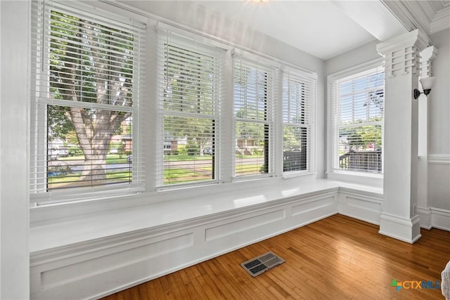 610 N 7th St, Temple, TX 76501 - detailed view of ornate columns, a decorative wall, wood finished floors, and a wainscoted wall