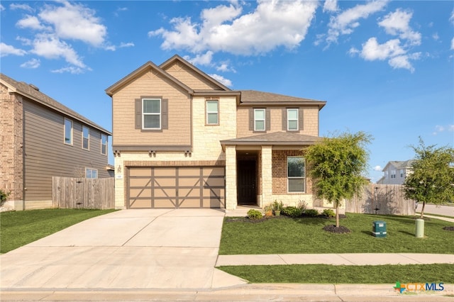 craftsman house with concrete driveway, a front yard, fence, a garage, and stone siding