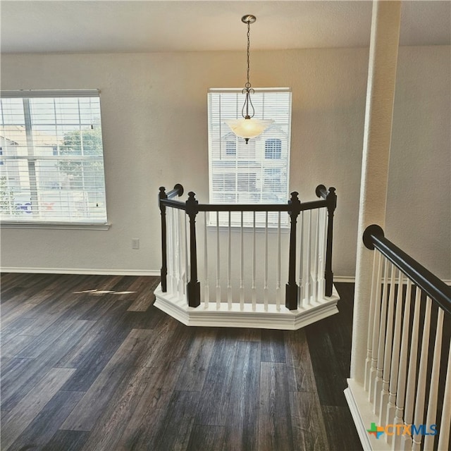 stairway featuring wood-type flooring