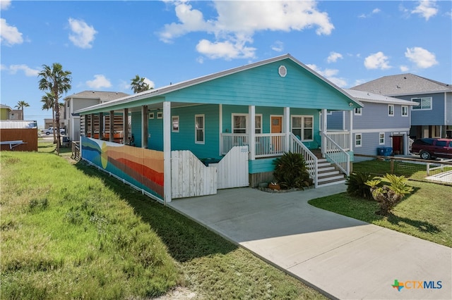 view of front facade featuring a front lawn and a porch