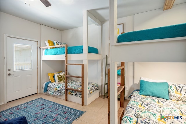 bedroom with light tile patterned floors and ceiling fan