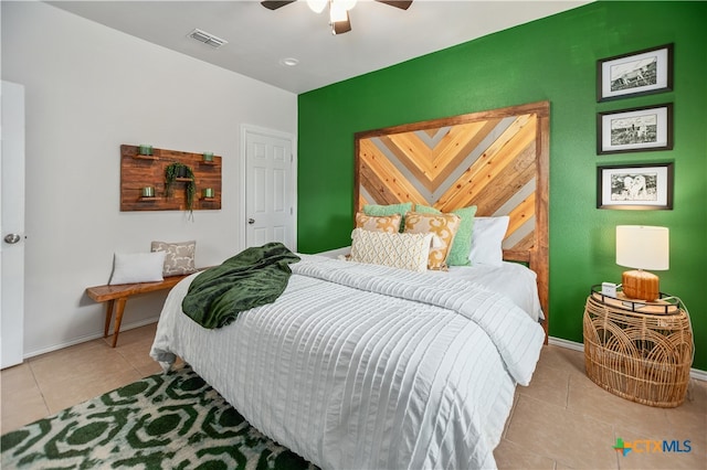 bedroom featuring ceiling fan and light tile patterned flooring