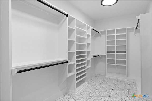 walk in closet featuring light tile patterned floors