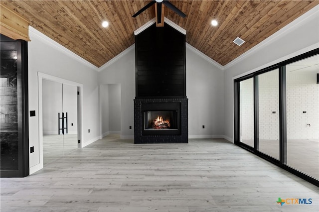 unfurnished living room featuring wood ceiling, a ceiling fan, visible vents, wood finished floors, and ornamental molding