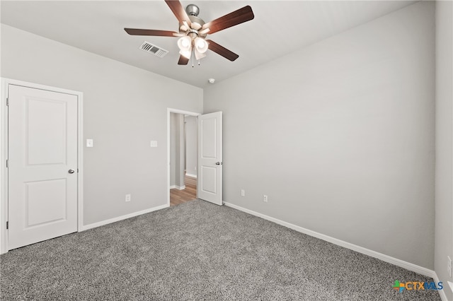 unfurnished bedroom featuring ceiling fan and carpet flooring