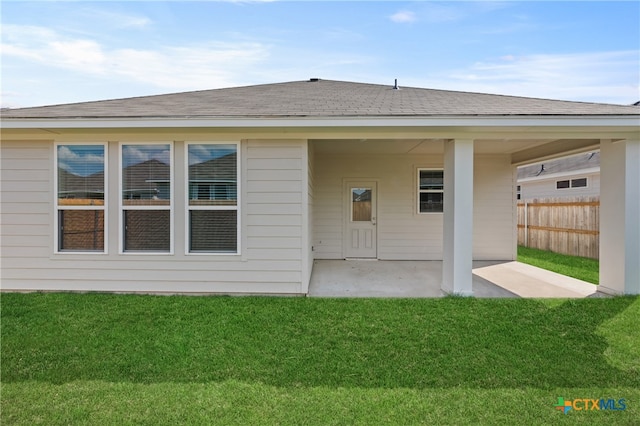 exterior space with a patio and a yard