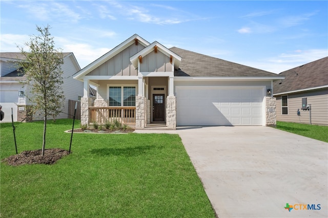 craftsman-style house with a garage and a front lawn