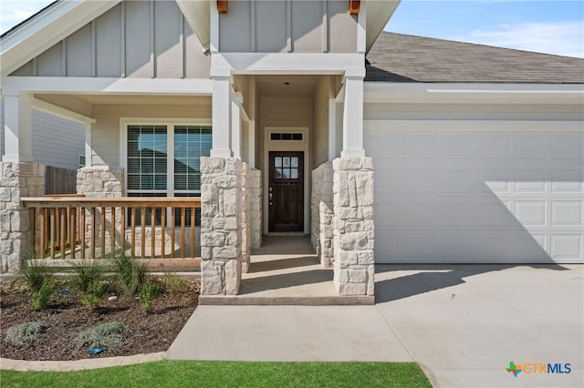 view of exterior entry with a garage