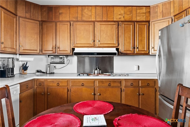 kitchen with stainless steel fridge and white dishwasher