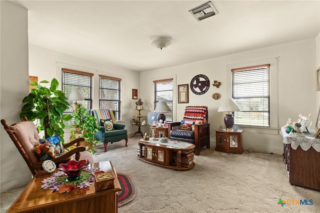 sitting room with light colored carpet