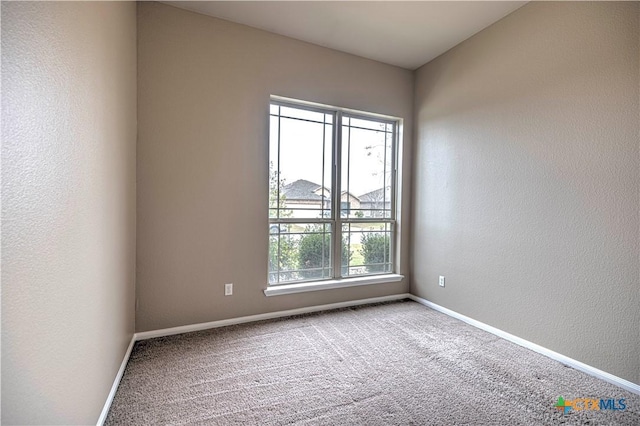 view of carpeted spare room