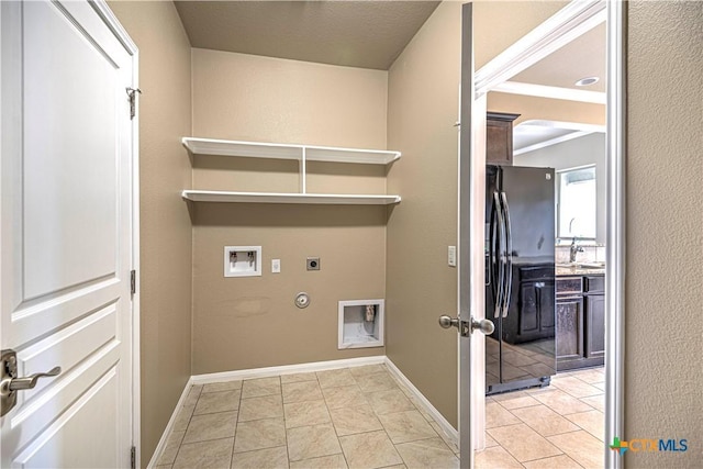 laundry room with electric dryer hookup, gas dryer hookup, sink, washer hookup, and light tile patterned flooring