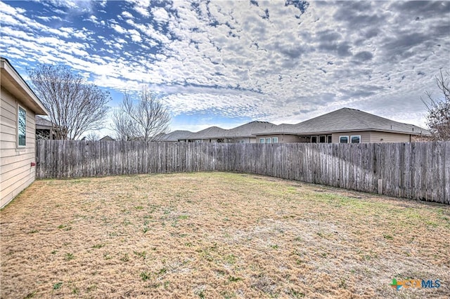 view of yard featuring a fenced backyard