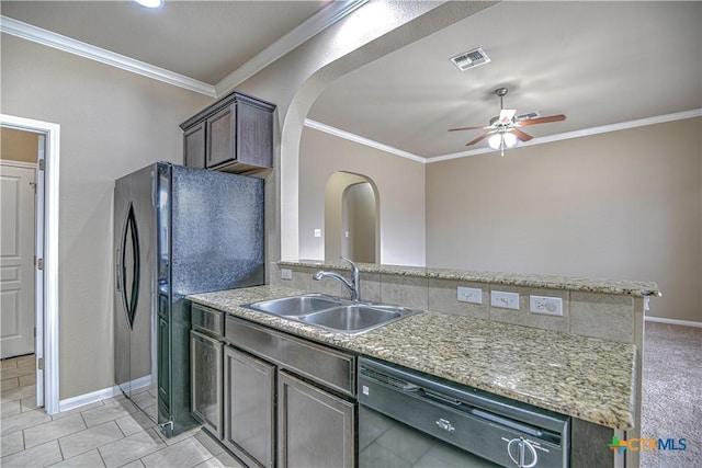 kitchen featuring a sink, visible vents, ornamental molding, freestanding refrigerator, and dishwasher