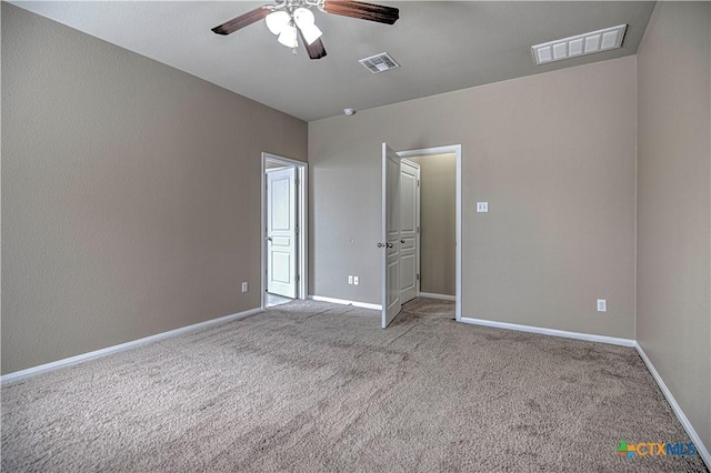 unfurnished bedroom with a ceiling fan, baseboards, visible vents, and carpet flooring