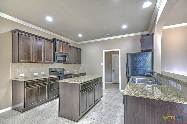 kitchen with dark brown cabinetry, a sink, backsplash, black appliances, and crown molding