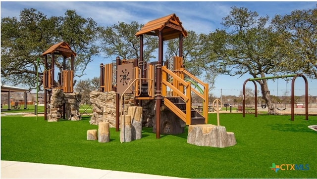 view of playground featuring a yard